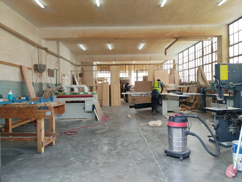 Panel saw and edge-banding station for cutting and finishing timber panels